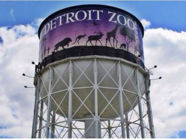 Image looking up at the Detroit Zoo logo on a water tower near the entrance of the zoo. 
