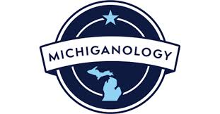 A logo with a blue background and white border with the word "MICHIGANOLOGY" written inside.